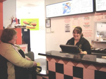 Mr C's Hot Dogs Restaurant Elgin Steph taking care of a customer